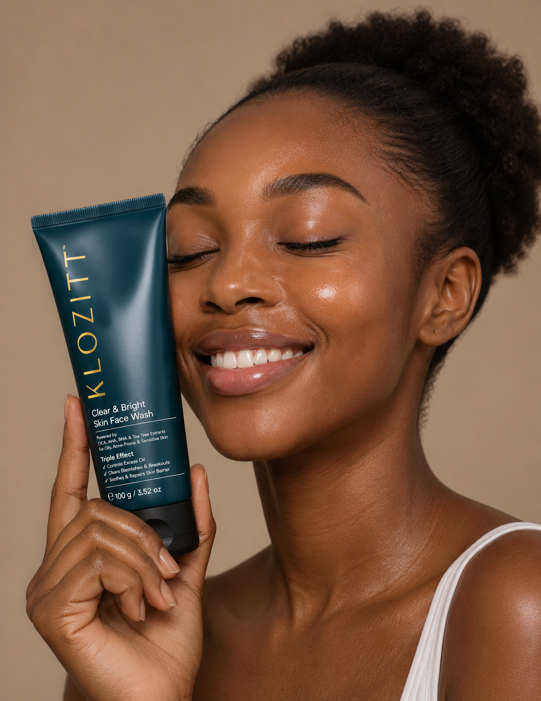 Model holding Clear & Bright Skin Face Wash